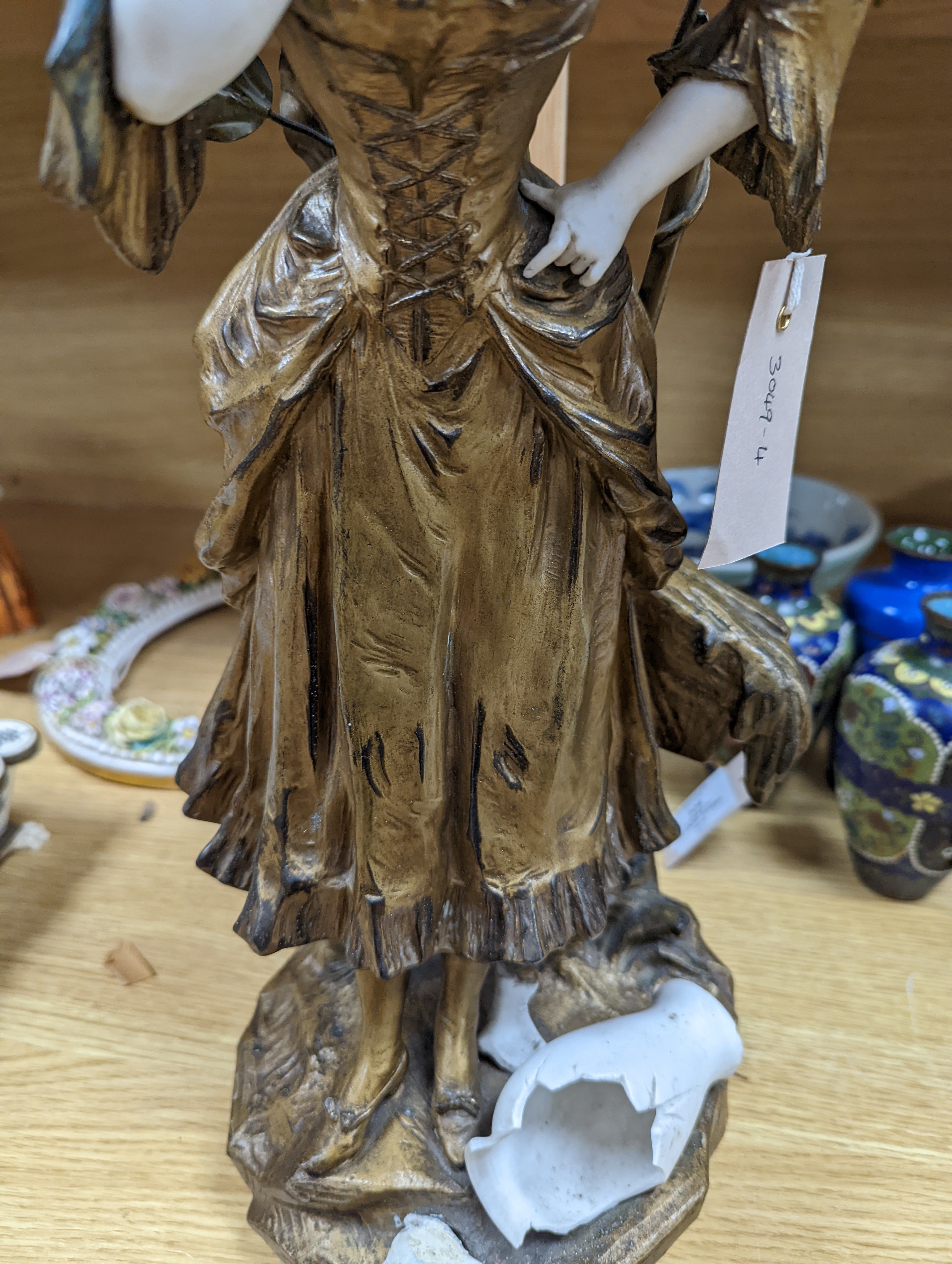 A late 19th Century French gilt spelter and bisque porcelain figure after Mednat 54cm